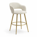 Taburete de bar con respaldo y brazos tapizado en bouclé blanco crema estructura de acero dorado con reposapiés circular 56 cm x 54 cm x 100 cm