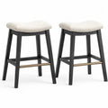 Pack de 2 taburetes de bar sin respaldo tapizados en tejido beige con estructura de madera negra y reposapiés metálico